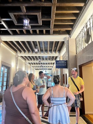 Chance (in yellow) sharing the history of the Governor's House