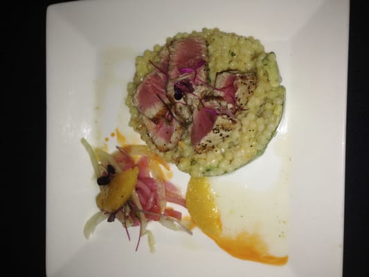 Seared ahi tuna.  On a bed of citrus flavored couscous and avacado, with a side of pickled fennel and red onion salad.  Fantast