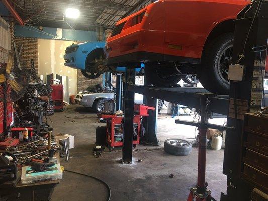 Three different MUSCLE CARS in the shop at one time! We can fix yours too. Muscles or not!