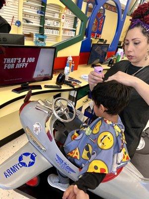 Cookie cutter haircut, airplane seats, clippers, Xiomara