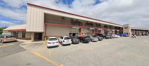 Building 1 (Beige building with red orange trim) at Harbor Center located at 98-023 Hekaha Street, Aiea HI 96701