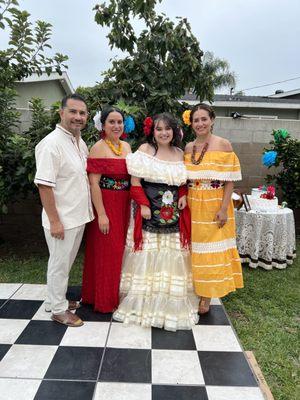 The guayabera, lady belt, white Veracruz dress and flower headpiece from Folklore store.