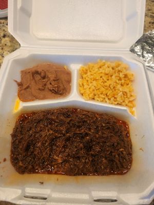 Barbacoa meat plate with beans and rice