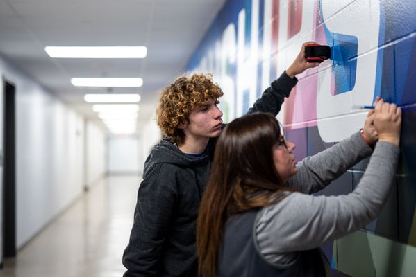 Transforming school walls with vibrant graphics! Our sign company's team brings creativity and expertise to elevate learning environments.