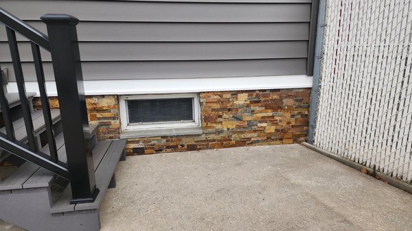 Stone veneer facade, steps and planter installed by Bianco's Landscaping & Masonry.