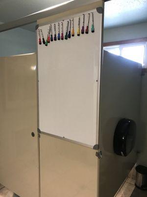 Fun dry erase board in ladies bathroom!