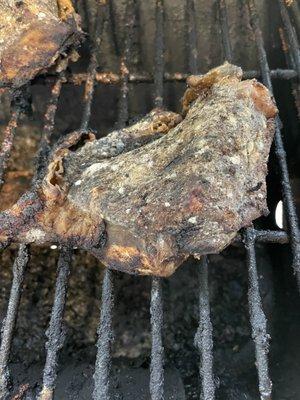 Detail of Rotting chicken on grill