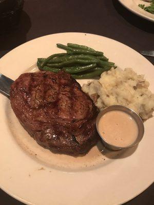 Delmonico Ribeye with mashed potatoes and green beans.