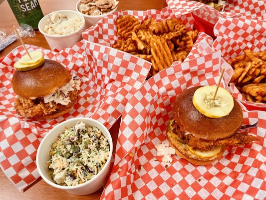 Fried chicken and shrimp sandwiches with fries and different sides