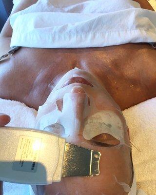 Performing a full relaxing hour long custom facial. Here we are penetrating a collagen mask with The Le Mieux facial sonic scrubber.