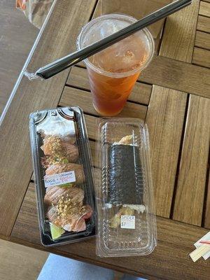 Seared salmon nigiri (with basil, garlic, & sea salt), spider hand roll, and iced lychee black tea with lychee jelly