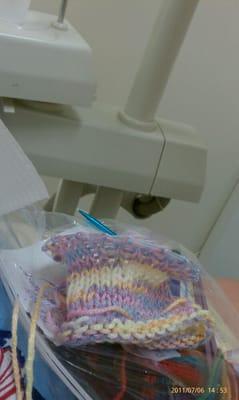 Knitting at the dentist's before a triple tooth extraction.