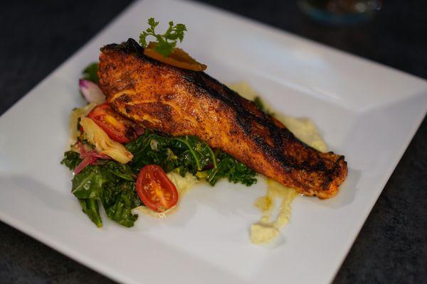 Our famous salmon on a bed of fried kale