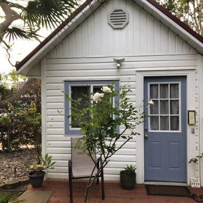 The new massage room, cute little cottage, lots of blond wood inside, 3 windows that open!