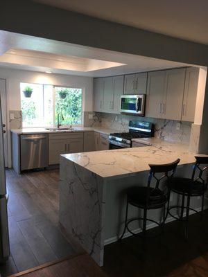 Kitchen Finished Product - Love the waterfall edge and the backsplash