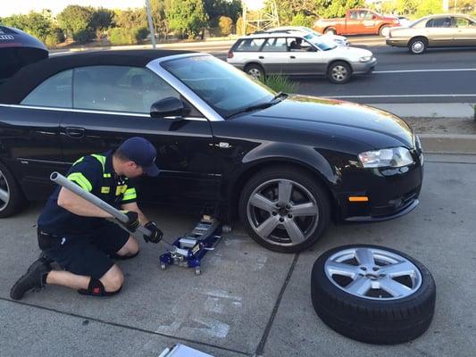 Changing Flat Tire For Stranded Motorist