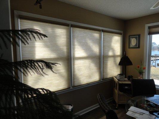 Honeycomb shades allow light into the home and provide privacy and energy savings by keeping this south facing room cooler in the summer.