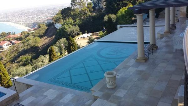 Automatic pool cover on Infinity Edge pool