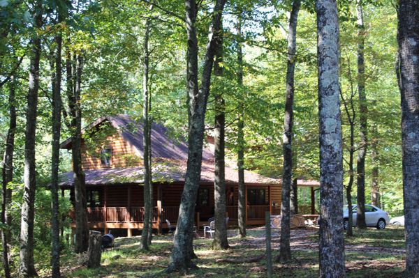 Cabin on the Blue! We used the nice nearly wrap around porch to set up our BBQ buffet, cake table, and gift table.