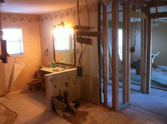 2015 BEFORE bath. Tore out tub, vanity, shower. Added 4' for "his closet" into 18x18 master bedroom.