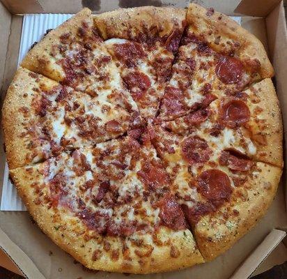 Large stuffed crust with extra cheese, bacon, half pepperoni.