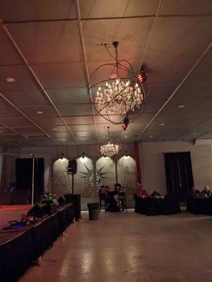 Chandeliers and dance floor in front of stage