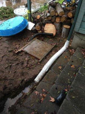 Underground flex drainage pipe was cut next to the footing. I had to make up this other drainage in the interim.