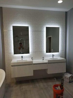 Large master bathroom remodel. New flooring, custom vanity and tile vanity wall