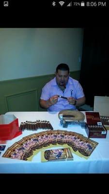 Our very own Dionis Pichardo hand rolling cigars at an event on behalf of Amadiz Cigars Inc.