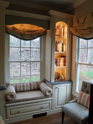 Custom cabinetry window seat in living room