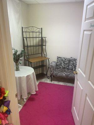 The fitting room (spacious & a chair for your purse or a kid to sit and wait while you try on!)