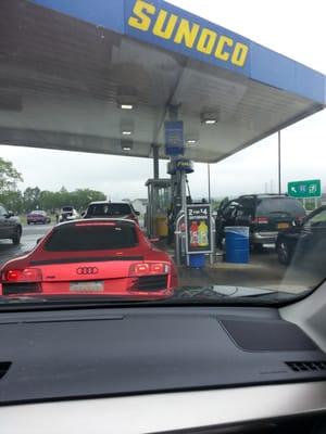 Fancy car getting gas.