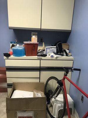 JUN 2018. Cluttered Supply room we were put into before the exam room opened up.