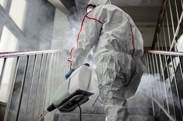 Technician fogging a room with antimicrobial