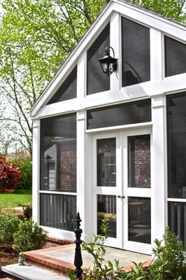 A gorgerous screened-in porch on one of Mission Hills' original farmhouses