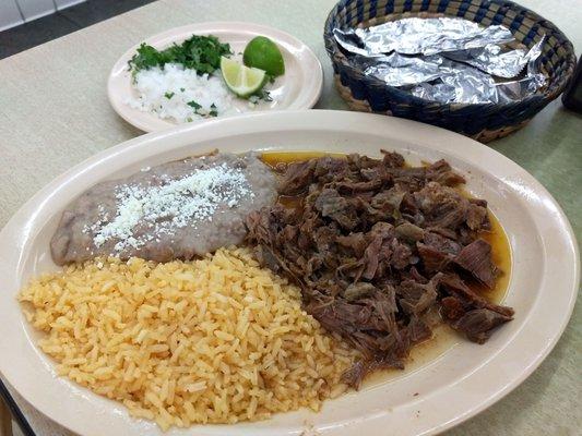 Birria plate. Tender juicy and delicious.The corn tortillas are handmade in house, and very tasty.