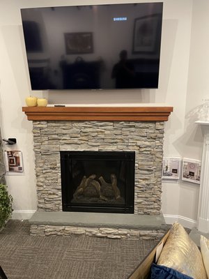 Bayport 36 by Kozy Heat, Stacked stone and a beam mantel