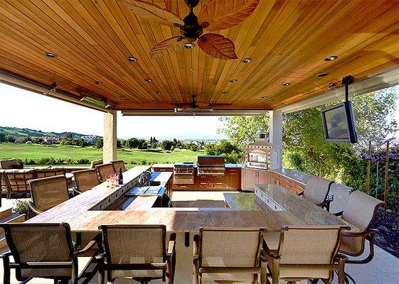 Outdoor kitchen and bar in granite. Fire pit not shown