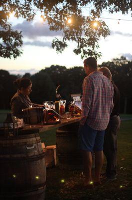 At the club's Bourbon, Brews & BBQ event, this bartender smoked the rim of the bourbon glass with wood and a blow torch!