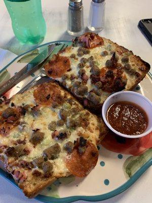 Cheesy garlic bread with pizza toppings.  This place is awesome!!!