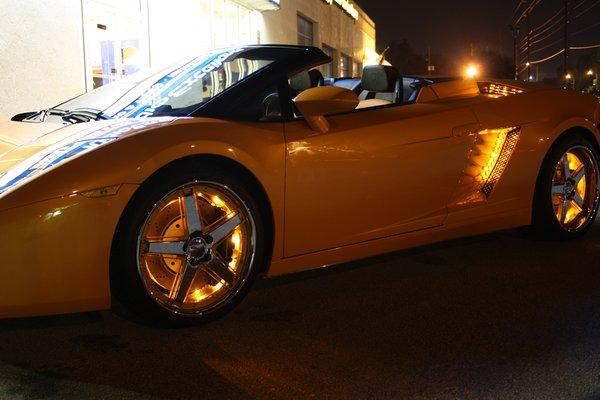 Custom lighting package on an orange Ferrari