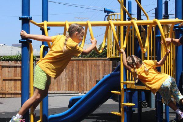 The campers having fun on the monkey bars