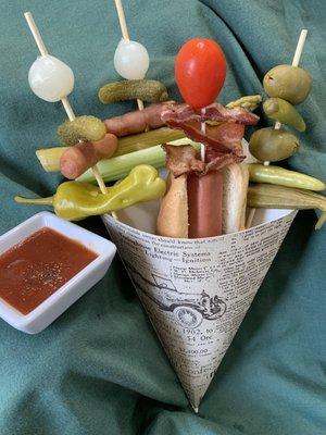 BLOODY MARY CONE -All beef Nathan's Dog, Bloody Mary Sauce and Bloody Mary Nibbles all tucked into a single serve cone.