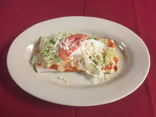 burritos deluxe  1 chicken & beans,1 beef and beans topped with lettuce sour cream guacamole Tomatoes and shredded chesse