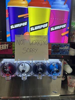 This sign says that the machine is not working but if you look closely it's filled with slurpee juice. Hmmm, something's fishy!