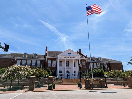 Photo I took of the outside of the Cary Arts Center today from Cary Downtown Park, with the American flag waving in the wind.