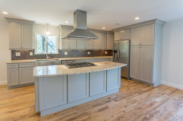 Custom Rebuild - Custom Kitchen with Island, Stainless Steel hood and Stainless Steel Appliances