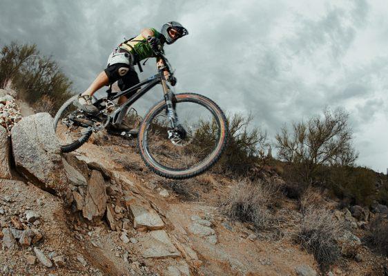 Downhill riding through rocky trail