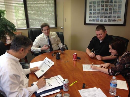 Signing loan documentation at the closing table!