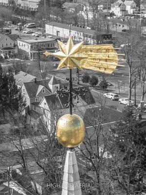 Beautiful aerial view of Halley's Comet weather vane on top of the steeple.